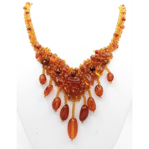 1406 - A pretty Baltic amber beads necklace. New condition. Approx 48cm length. Handmade in Russia.