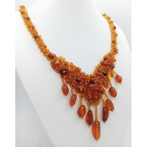 1406 - A pretty Baltic amber beads necklace. New condition. Approx 48cm length. Handmade in Russia.