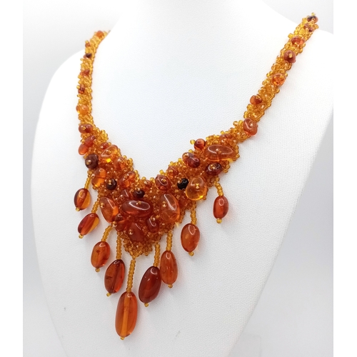 1406 - A pretty Baltic amber beads necklace. New condition. Approx 48cm length. Handmade in Russia.