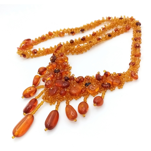 1406 - A pretty Baltic amber beads necklace. New condition. Approx 48cm length. Handmade in Russia.