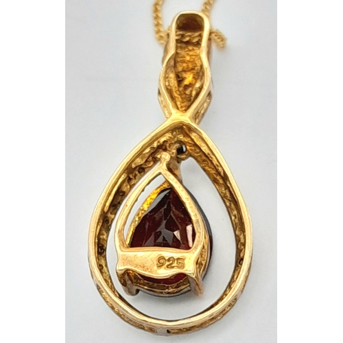 1040 - A 925 gilded silver Garnet and stone set pendant, set on a gilded silver necklace. Total weight 3.3G... 