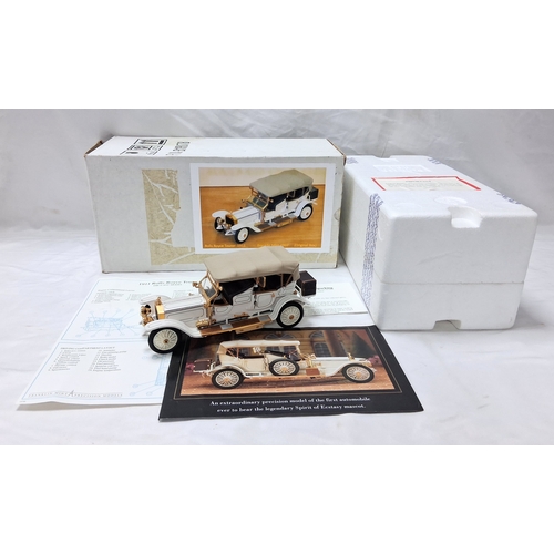 A Franklin Mint 1911 Rolls Royce Tourer. 1/24th scale. Very good condition with all paperwork. Box has some wear.