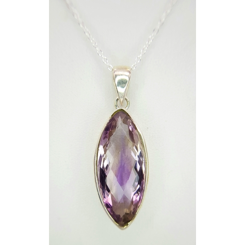 101 - An Amethyst 25 Silver Pendant. Faceted marquise shape. Comes with a thin silver chain. 4cm pendant. ... 