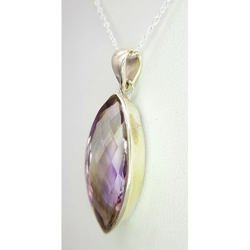 101 - An Amethyst 25 Silver Pendant. Faceted marquise shape. Comes with a thin silver chain. 4cm pendant. ... 