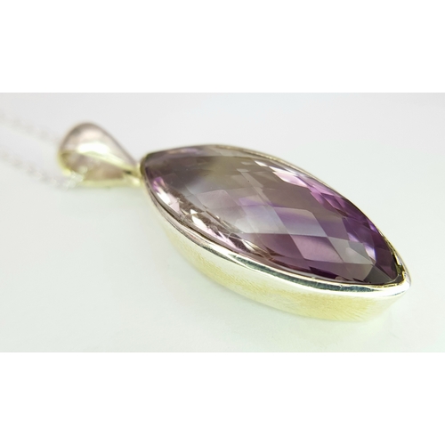 101 - An Amethyst 25 Silver Pendant. Faceted marquise shape. Comes with a thin silver chain. 4cm pendant. ... 