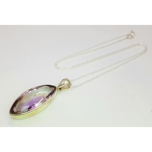 101 - An Amethyst 25 Silver Pendant. Faceted marquise shape. Comes with a thin silver chain. 4cm pendant. ... 