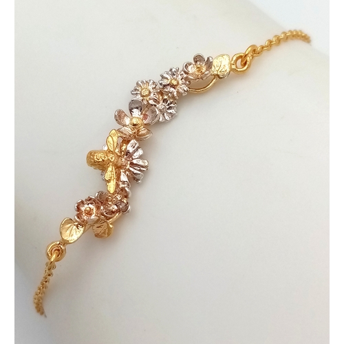 115 - An Alex Monroe, Designer Gilded Bracelet with Hanging Floral Form Pendant. 18cm in length. Comes wit... 