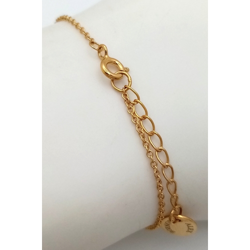 115 - An Alex Monroe, Designer Gilded Bracelet with Hanging Floral Form Pendant. 18cm in length. Comes wit... 