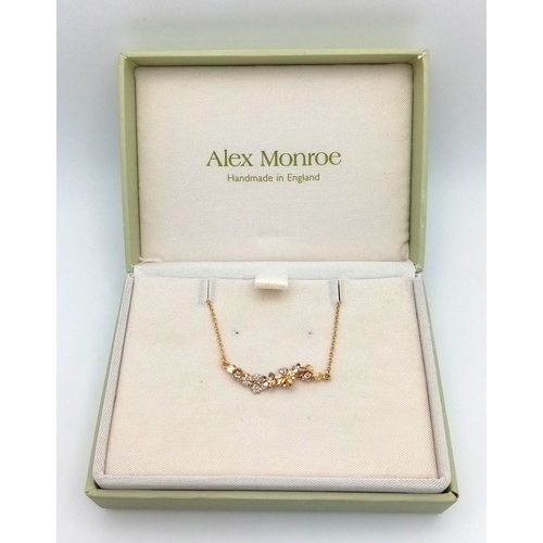 115 - An Alex Monroe, Designer Gilded Bracelet with Hanging Floral Form Pendant. 18cm in length. Comes wit... 