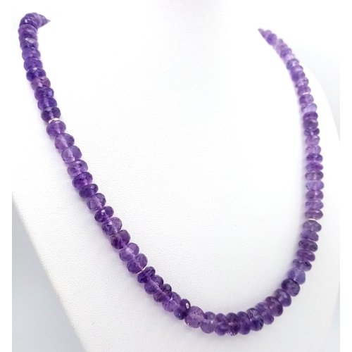 143 - An Amethyst Rondelle Gemstone Necklace. 925 Silver Clasp.
42cm length. 26.7g total weight. CD-2074.