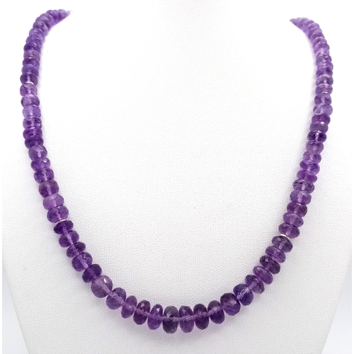 143 - An Amethyst Rondelle Gemstone Necklace. 925 Silver Clasp.
42cm length. 26.7g total weight. CD-2074.