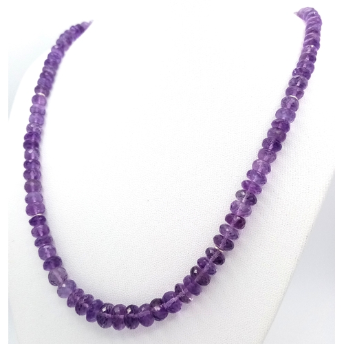 143 - An Amethyst Rondelle Gemstone Necklace. 925 Silver Clasp.
42cm length. 26.7g total weight. CD-2074.