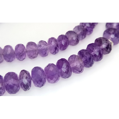 143 - An Amethyst Rondelle Gemstone Necklace. 925 Silver Clasp.
42cm length. 26.7g total weight. CD-2074.