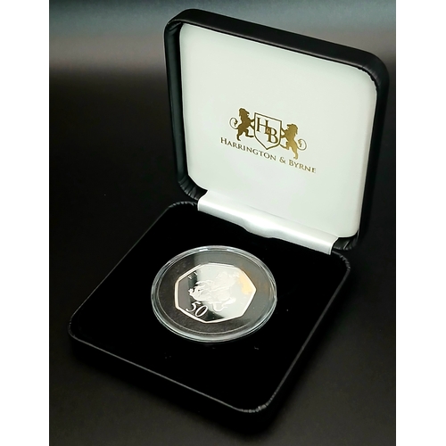 1065 - A Harrington and Byrne Commemorative Fine Silver (.999 purity) Proof 50p Coin. 15.56g. Comes with ca... 