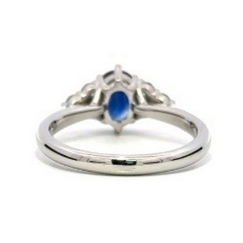 97 - A Platinum natural Blue Sapphire and Diamond Ring. Blue sapphire - 0.98ct. Diamond - 0.26ct. Size M.... 