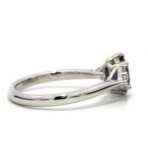 97 - A Platinum natural Blue Sapphire and Diamond Ring. Blue sapphire - 0.98ct. Diamond - 0.26ct. Size M.... 