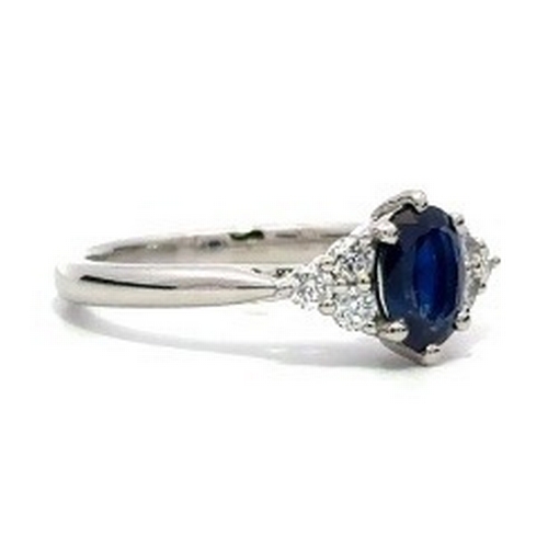 97 - A Platinum natural Blue Sapphire and Diamond Ring. Blue sapphire - 0.98ct. Diamond - 0.26ct. Size M.... 