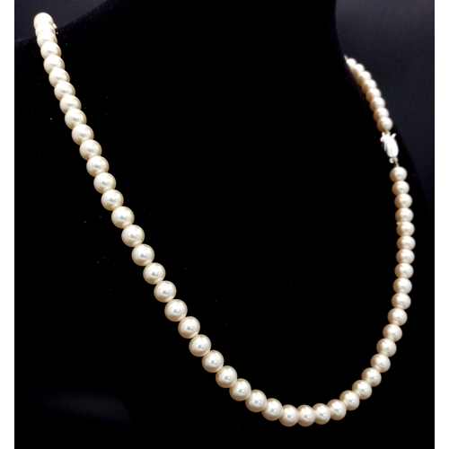 1031 - A Vintage Pearl Necklace with Silver Clasp. 56cm.