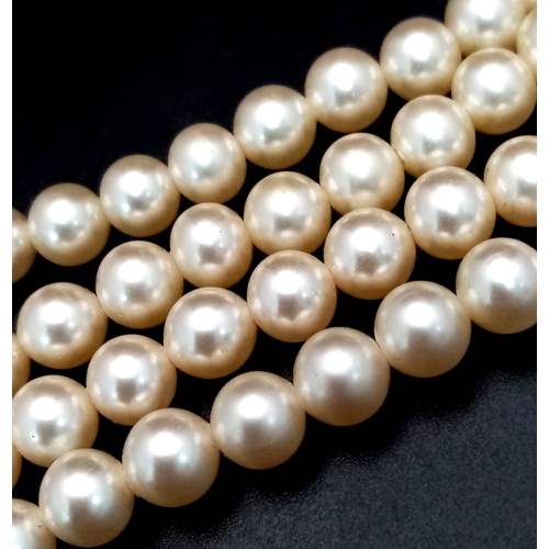 1031 - A Vintage Pearl Necklace with Silver Clasp. 56cm.