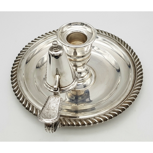 542 - A Mappin and Webb Sterling Silver Chamberstick Candle Holder. A round tray with decorative edge. Han... 