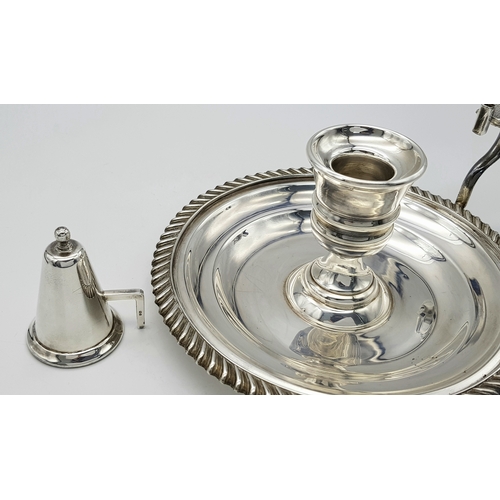 542 - A Mappin and Webb Sterling Silver Chamberstick Candle Holder. A round tray with decorative edge. Han... 