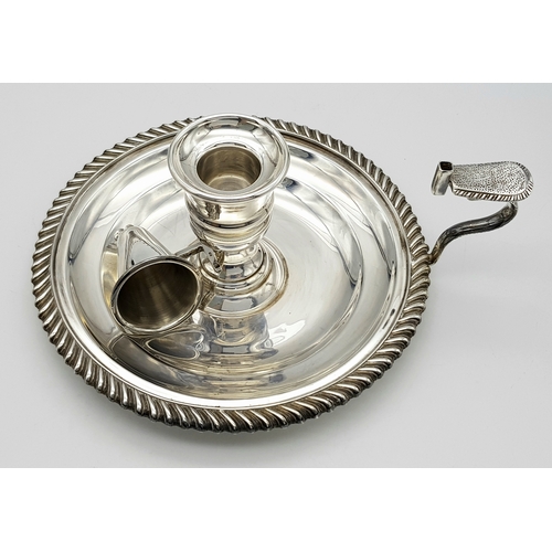 542 - A Mappin and Webb Sterling Silver Chamberstick Candle Holder. A round tray with decorative edge. Han... 