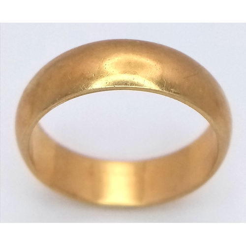25 - An 18K Yellow Gold Band Ring. Full UK hallmarks. 6mm width. Size O. 6.35g.