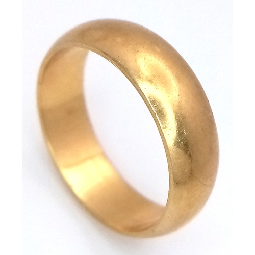 25 - An 18K Yellow Gold Band Ring. Full UK hallmarks. 6mm width. Size O. 6.35g.