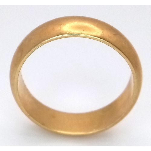 25 - An 18K Yellow Gold Band Ring. Full UK hallmarks. 6mm width. Size O. 6.35g.