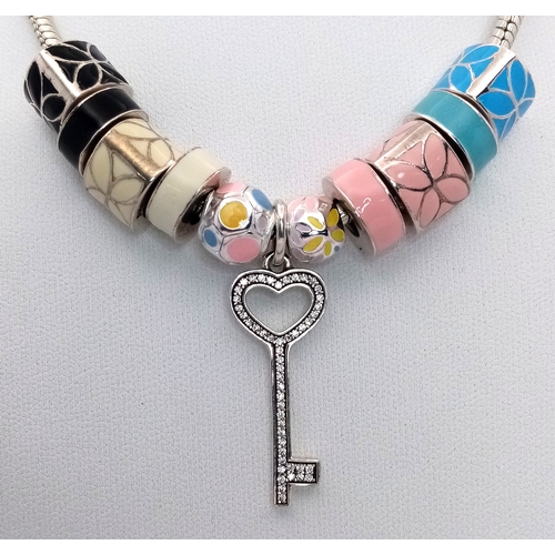 35 - Genuine PANDORA SILVER NECKLACE complete with 10 Enamelled SILVER CHARMS plus a SILVER KEY PENDANT. ... 