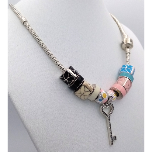 35 - Genuine PANDORA SILVER NECKLACE complete with 10 Enamelled SILVER CHARMS plus a SILVER KEY PENDANT. ... 