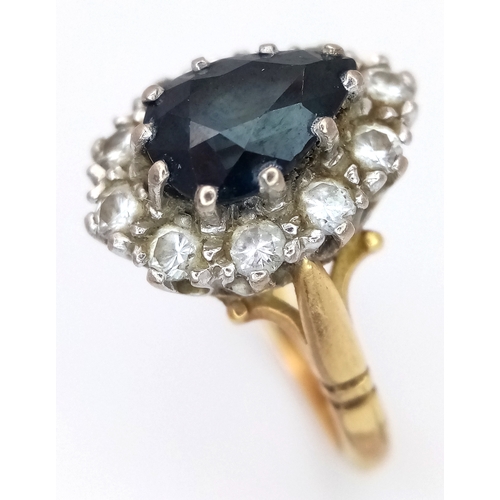 46 - An 18K Yellow Gold Diamond and Sapphire Ring. A 1.5ct pear-shaped sapphire with a 0.50ctw diamond su... 