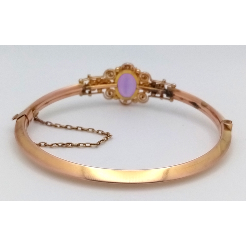 56 - Fabulous Vintage 9 CARAT GOLD BANGLE. Set with large Oval Cut AMETHYST and Seed PEARLS. Complete wit... 