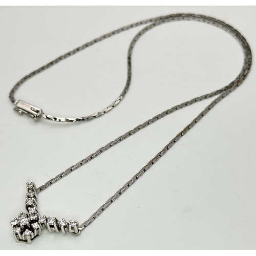 58 - An 18K White Gold Diamond Lavaliere Necklace - 0.90ctw of round brilliant cut diamonds. 7.3g. 42cm. ... 
