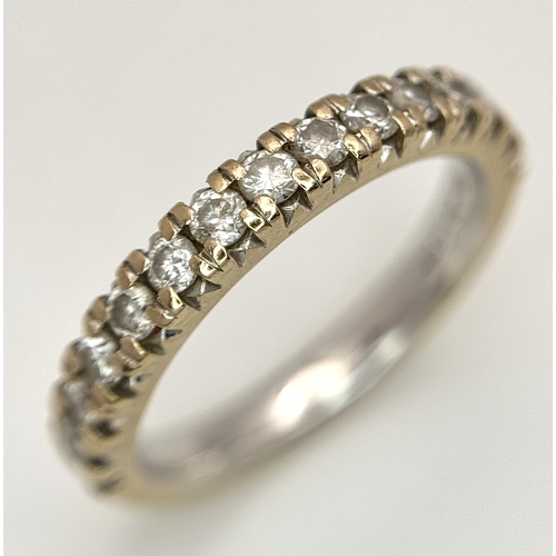 60 - An 18k Gold and Diamond Half Eternity Ring. 0.50ctw. Size L. 4.1g total weight.