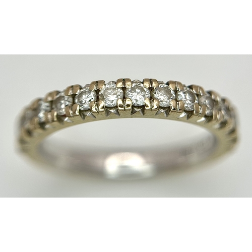 60 - An 18k Gold and Diamond Half Eternity Ring. 0.50ctw. Size L. 4.1g total weight.