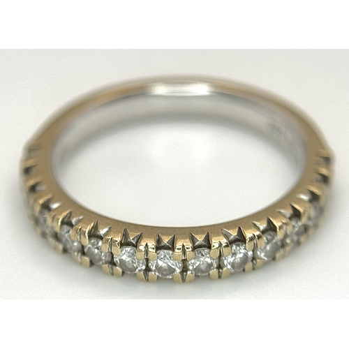 60 - An 18k Gold and Diamond Half Eternity Ring. 0.50ctw. Size L. 4.1g total weight.