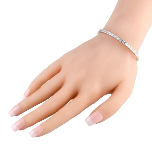63 - An 18K White Gold 4.0ct Diamond Bracelet. Square-cut diamonds with a total weight of 4.0 carats serv... 
