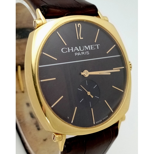 62 - A Sophisticated Chaumet of Paris 18K Gold Dandy Automatic Gents Watch. Brown leather strap with 18K ... 