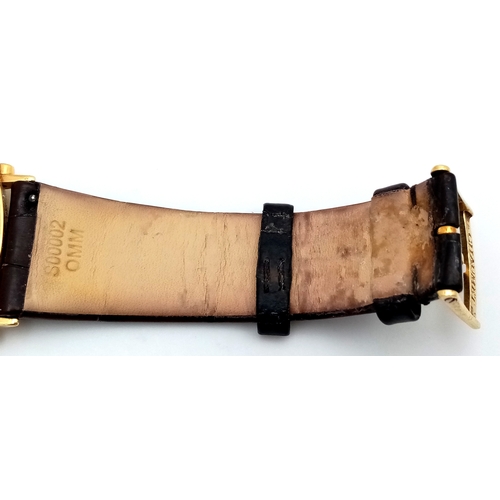 62 - A Sophisticated Chaumet of Paris 18K Gold Dandy Automatic Gents Watch. Brown leather strap with 18K ... 