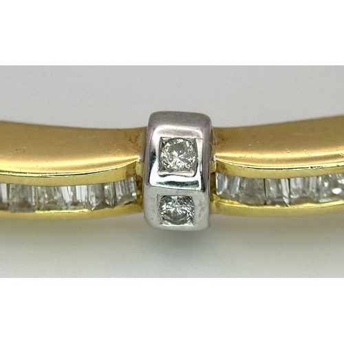 65 - An 18K Yellow Gold and Diamond Bangle. 1ctw of tapered baguette and round brilliant cut diamonds. Cl... 