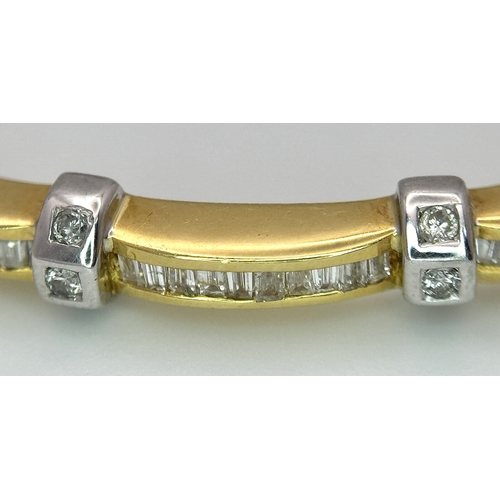 65 - An 18K Yellow Gold and Diamond Bangle. 1ctw of tapered baguette and round brilliant cut diamonds. Cl... 