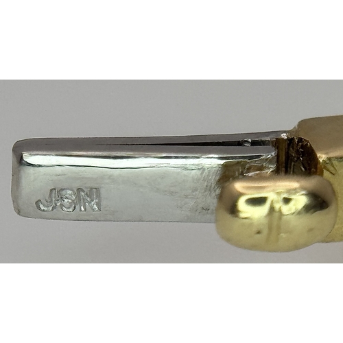 65 - An 18K Yellow Gold and Diamond Bangle. 1ctw of tapered baguette and round brilliant cut diamonds. Cl... 