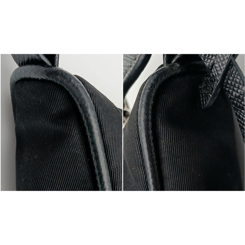 68 - A Prada Re-Edition Black Nylon Shoulder Bag. Black nylon exterior with silver-toned hardware, single... 