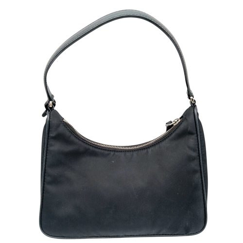 68 - A Prada Re-Edition Black Nylon Shoulder Bag. Black nylon exterior with silver-toned hardware, single... 