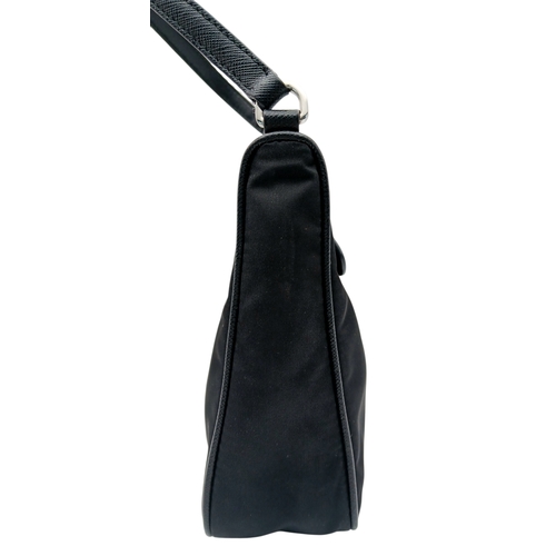 68 - A Prada Re-Edition Black Nylon Shoulder Bag. Black nylon exterior with silver-toned hardware, single... 