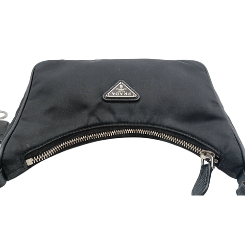 68 - A Prada Re-Edition Black Nylon Shoulder Bag. Black nylon exterior with silver-toned hardware, single... 