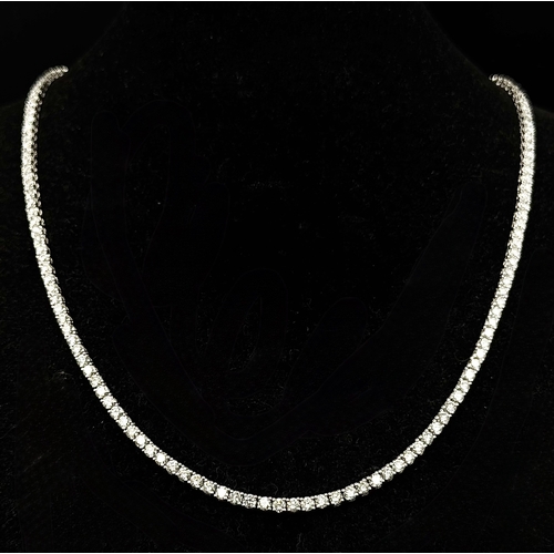 79 - A W.G.I. Certified 10k White Gold and Lab Grown Diamond Necklace. Set with 10.58ctw of 150 round bri... 