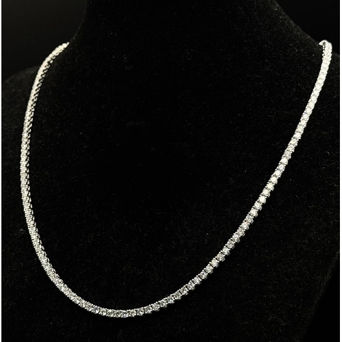 79 - A W.G.I. Certified 10k White Gold and Lab Grown Diamond Necklace. Set with 10.58ctw of 150 round bri... 