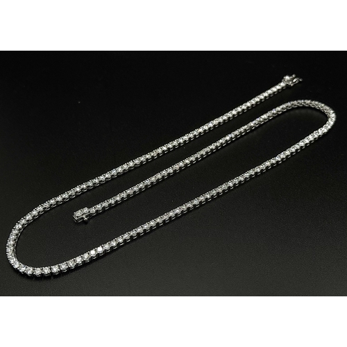 79 - A W.G.I. Certified 10k White Gold and Lab Grown Diamond Necklace. Set with 10.58ctw of 150 round bri... 